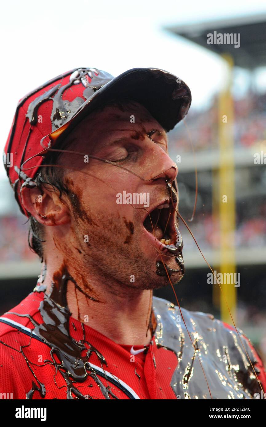 Washington Nationals Max Scherzer can only smile as he is drenched in  celebratory chocolate syrup after pitching a no-hitter against the  Pittsburgh Pirates at Nationals Park on June 20, 2015 in Washington