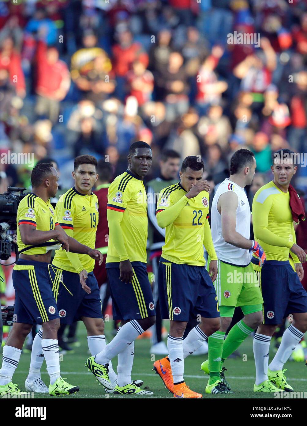 Colombia's players leave the field after losing their match against
