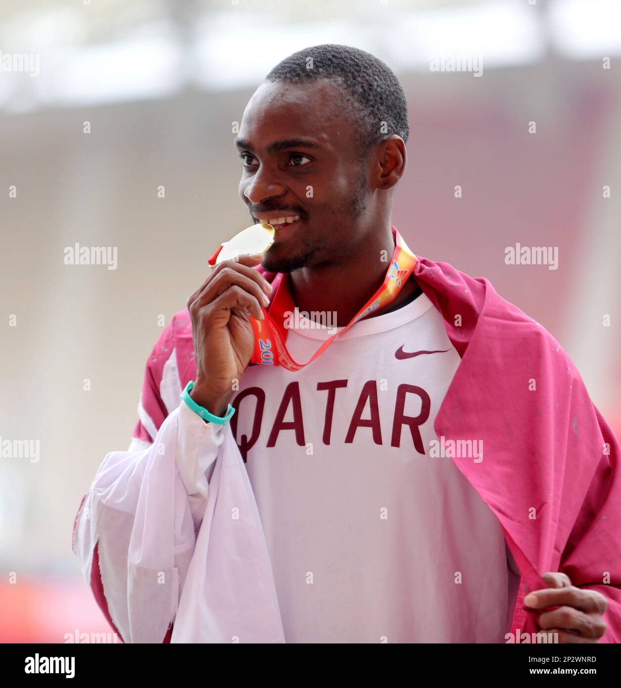 Gold medalist Femi Ogunode of Qatar poses after winning the men's 100m and  breaking his previous Asian record during the 21st Asian Athletics  Championships in Wuhan city, central China's Hubei province, 4