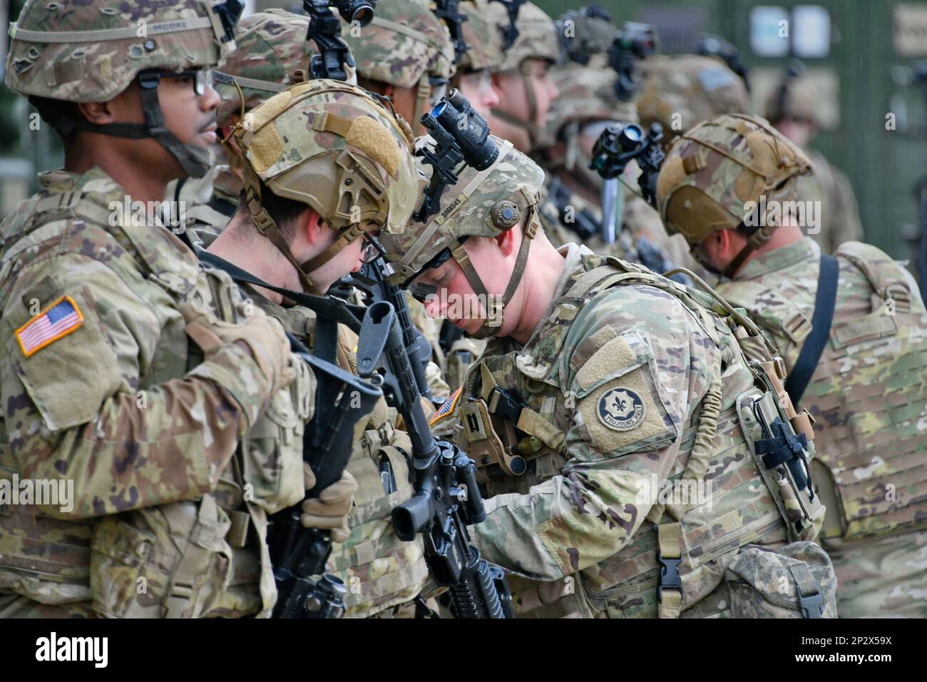 U.S. Army Cpt. Scott Murray, center, the Commander of Palehorse Troop, 4th Squadron, 2nd Cavalry Regiment inspects Soldiers ahead of a training exercise on Rose Barracks, Vilseck, Germany, Jan. 10, 2023. 2CR provides V Corps with a lethal and agile force capable of rapid deployment throughout the European theater in order to assure allies, deter adversaries, and when ordered, defend the NATO alliance. Stock Photo