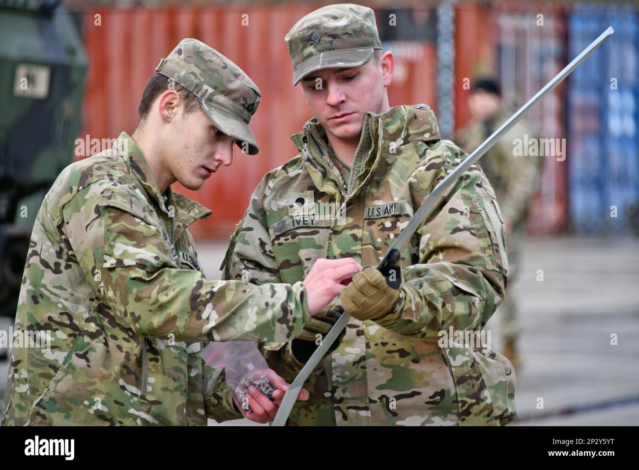 U.S. Army Spc. Charles Ivey, right, with Palehorse Troop, 4th Squadron, 2nd Cavalry Regiment supervises the assembly of an RQ-11 Raven, a Small Unmanned Aircraft System, ahead of a training exercise on Rose Barracks, Vilseck, Germany, Jan. 10, 2023. 2CR provides V Corps with a lethal and agile force capable of rapid deployment throughout the European theater in order to assure allies, deter adversaries, and when ordered, defend the NATO alliance. Stock Photo