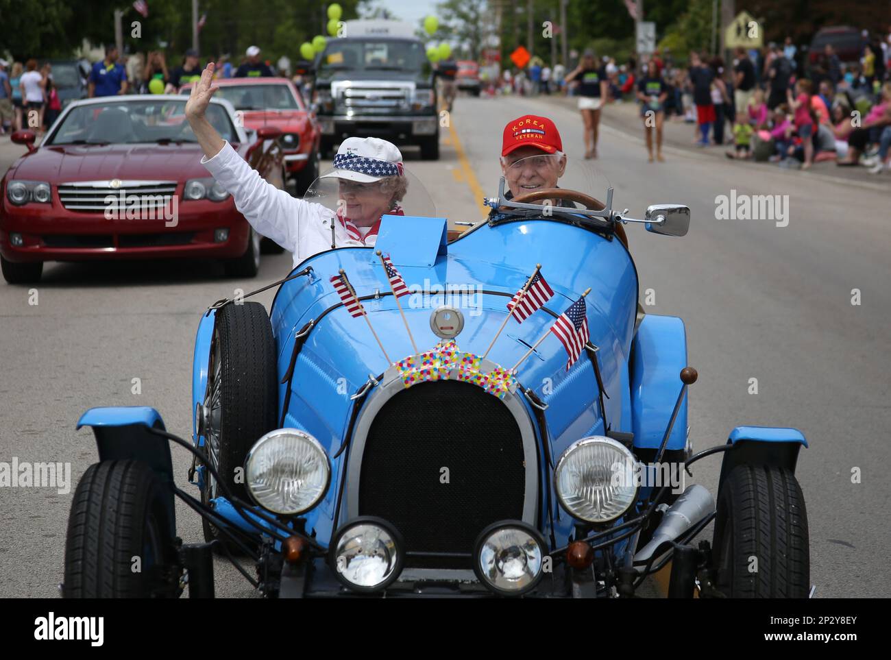 People drive classic cars during the Fruitport Old Fashioned Days