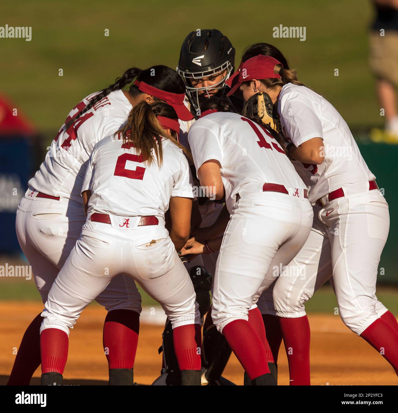Alabama gather up to cheer before the first pitch during an NCAA super
