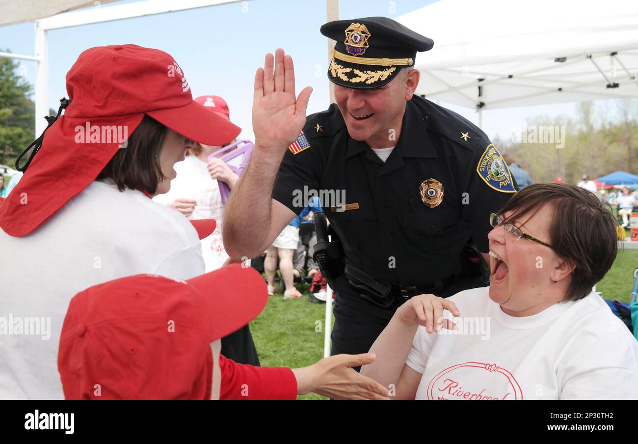 Stockbridge Police Chief Robert Eaton encourages the athletes at the