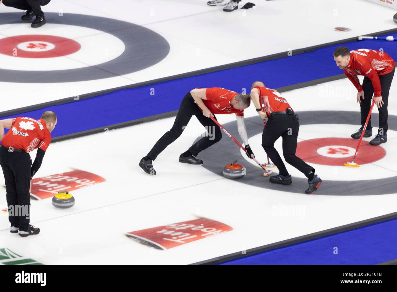 Team Canada makes a shot against Team Ontario during the Tim Hortons