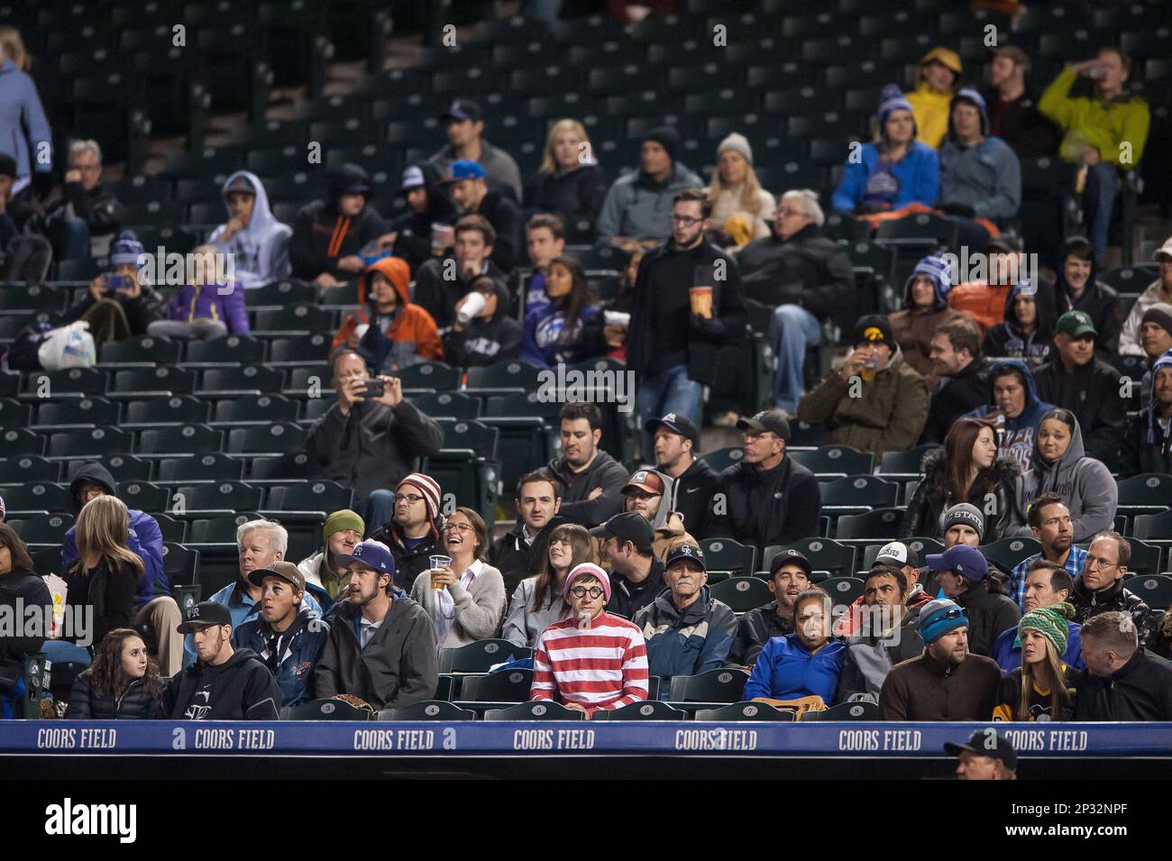 20 APRIL 2015 A fan dressed up as Waldo takes in the game from the first row behind the home team dugout during a regular season Major League Baseball game between the