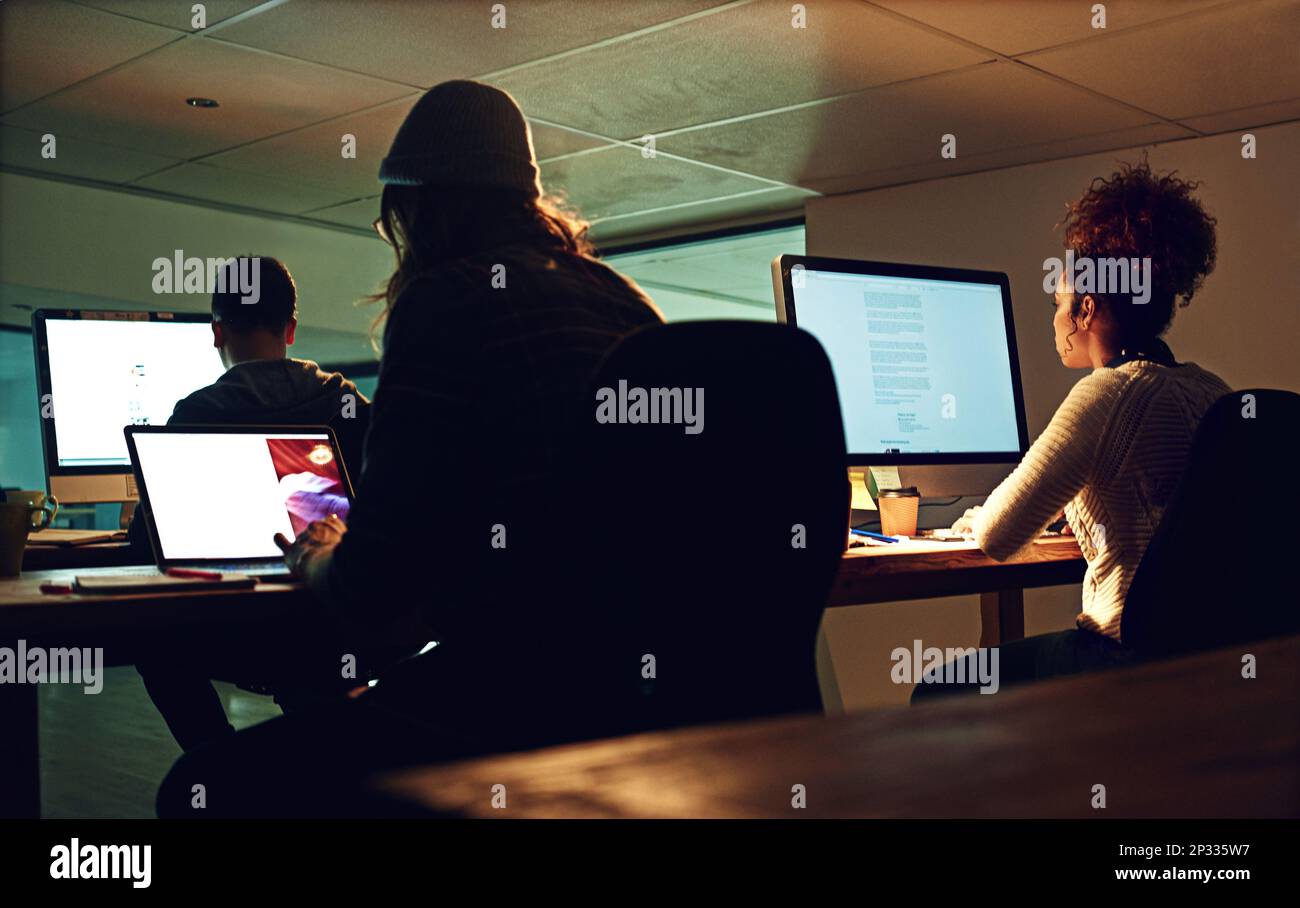 Computer, coworking team or night people programming ERP software, cybersecurity system or online server code. Startup data center, ai developer or Stock Photo