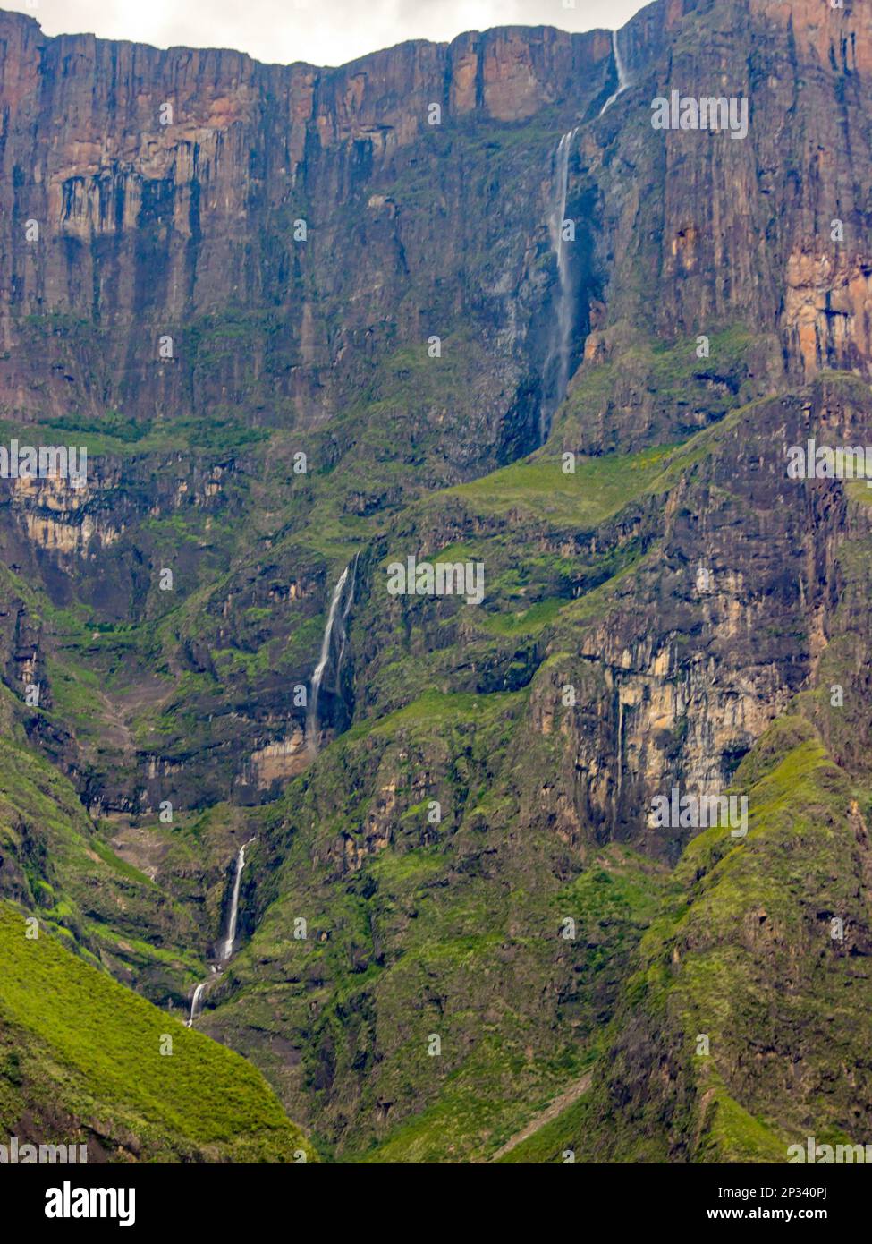 Distant view of Majestic Tugela Falls, plummeting down the sheer basalt cliffs of the Amphitheater in the Drakensberg Mountains of South Africa Stock Photo