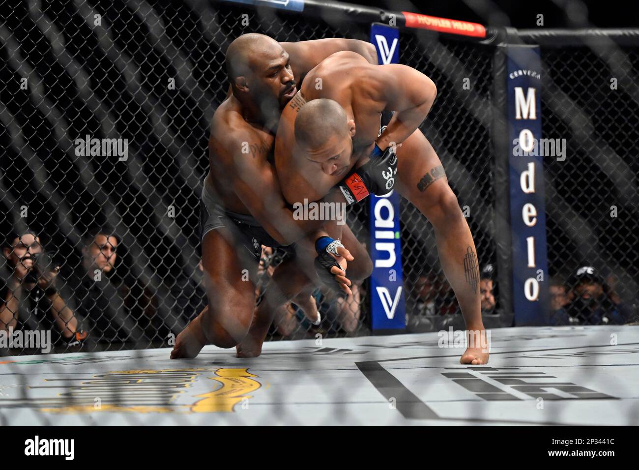 Jon Jones, left, takes down Ciryl Gane during a UFC 285 mixed martial ...