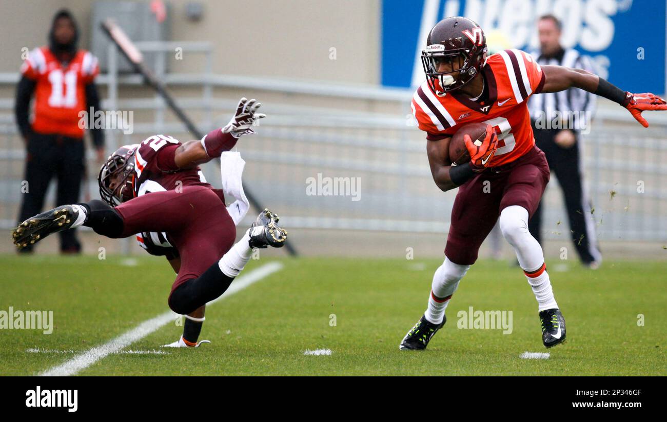 Greg Stroman (3) right, evades Deon Newsome (20) left, and returns a punt  for a touchdown during the annual Virginia Tech football Maroon - Orange  spring football game in Blacksburg, Va., Saturday