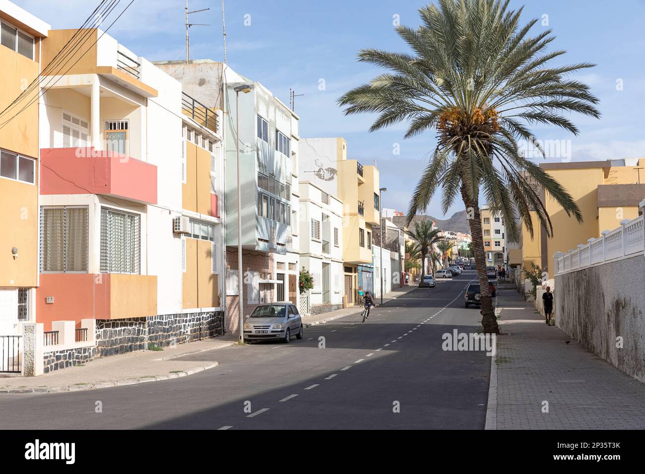 Colourful streets of Mindelo city with picturesque houses and tropical palm trees, Mindelo, Sao Vicente island, Cabo verde Stock Photo