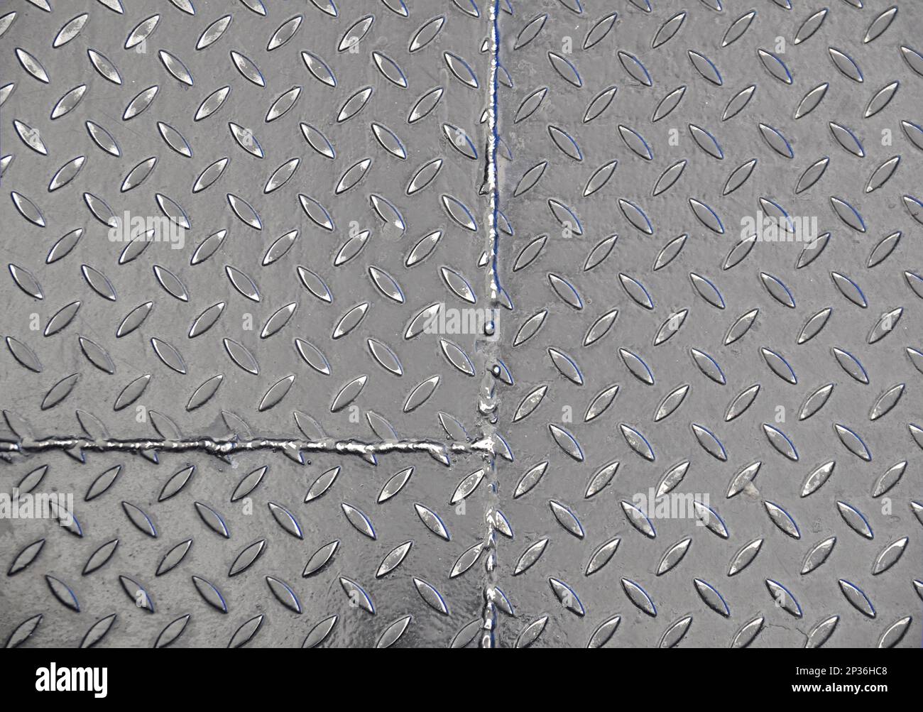 Closeup of the texture of a corrugated steel sheet. Weld seam Stock