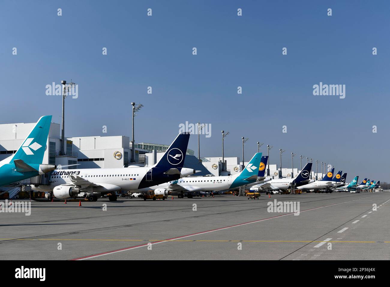 Lufthansa and Air Dolomiti aircraft parked in position at Terminal 2 ...