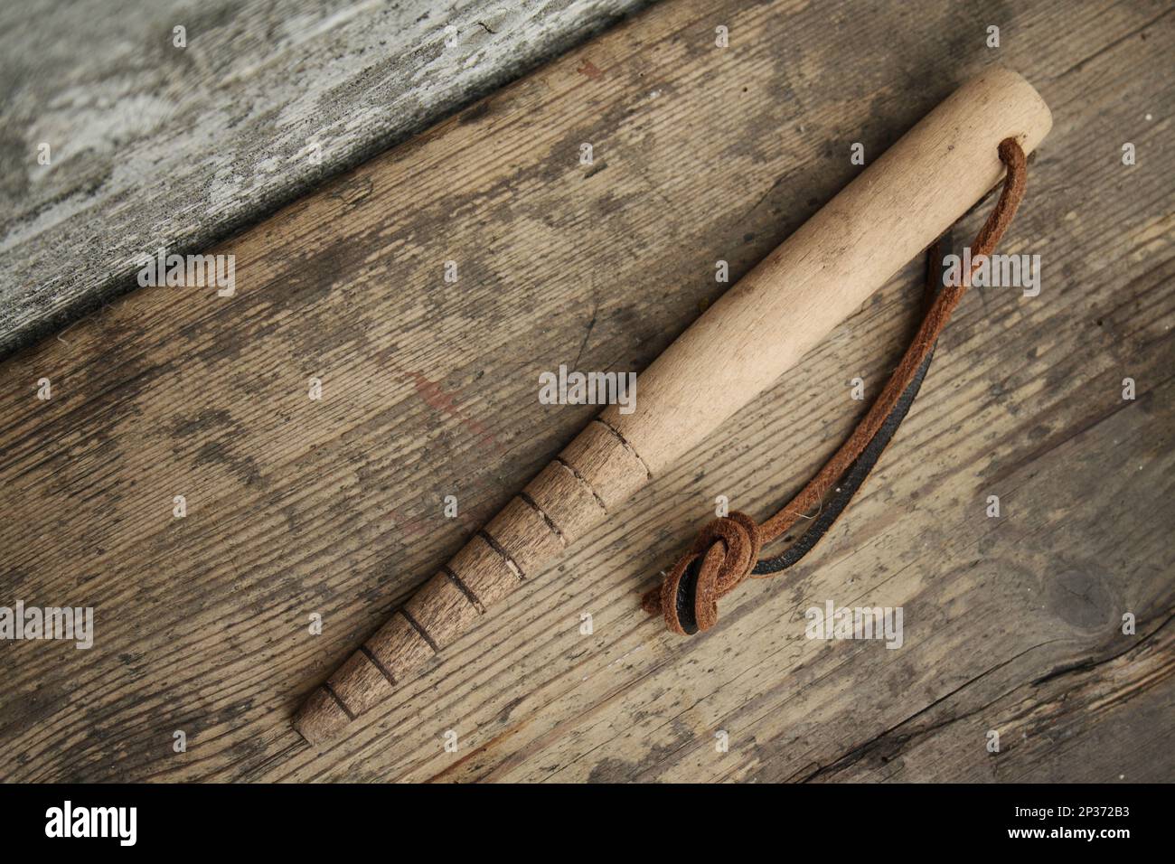 'Dibblet' wooden dibber garden tool, on garden vegatable plot, Mendlesham, Suffolk, England, United Kingdom Stock Photo