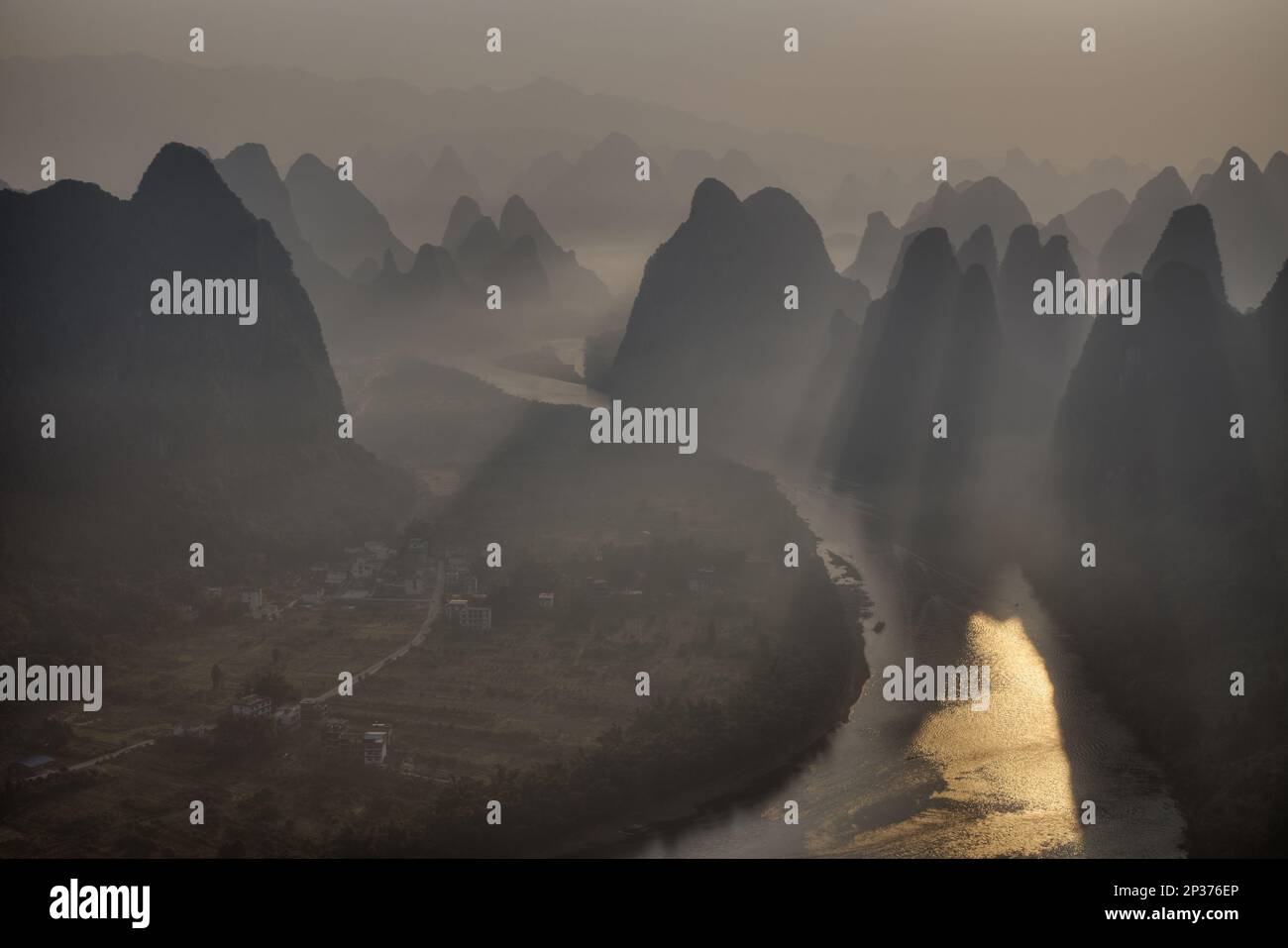 View of limestone karst formations along the river at sunrise, Li River, Guilin, Guangxi Zhuang Autonomous Region, China Stock Photo