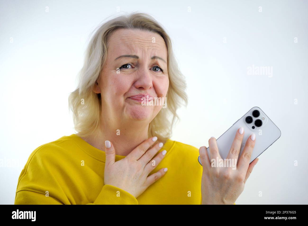 unpleasant conversation on phone woman keeps her hand on her neck and