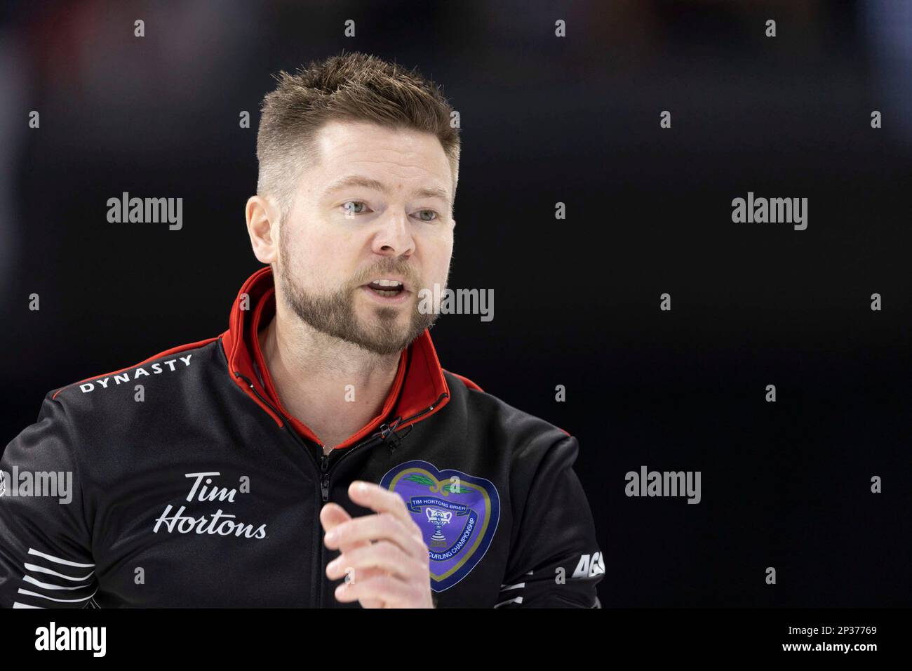 Team Ontario skip, Mike McEwen calls to his sweepers against Team