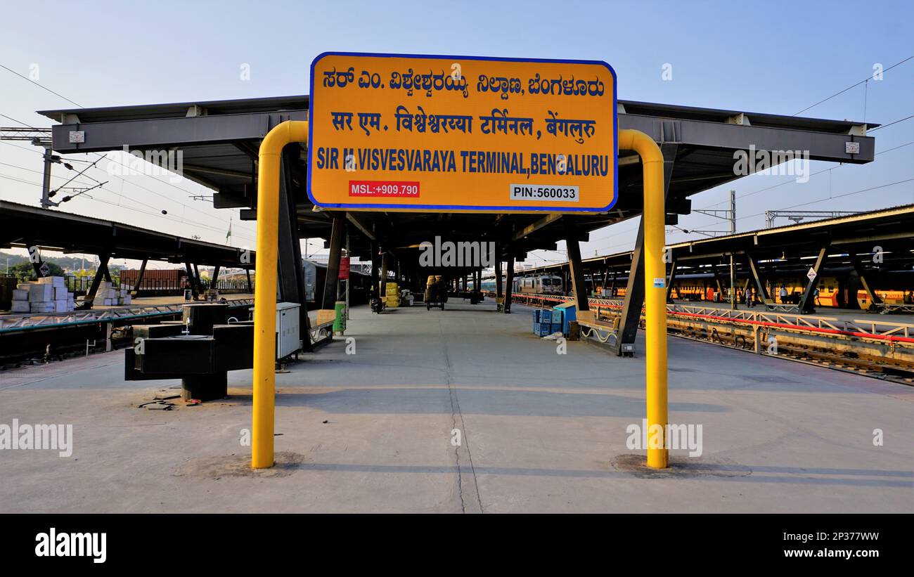Bangalore,Karnataka,India-January 01 2023: Sign board inside the Sir M Visvesvaraya Terminal or SMVB. Yellow board in English, Hindi and Kannada Stock Photo