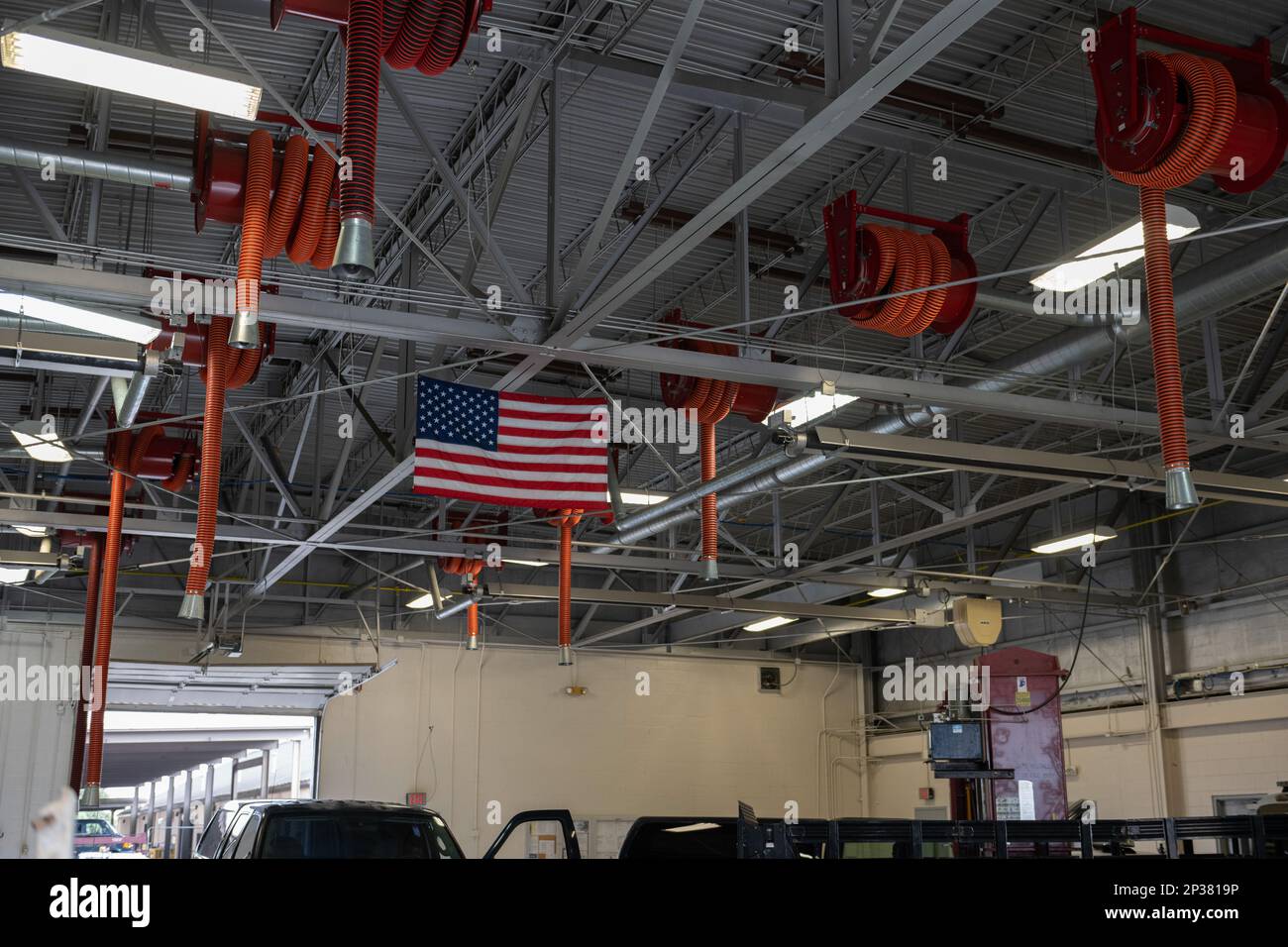 Ten exhaust pipes hang from the ceiling in the 23rd Logistics Readiness