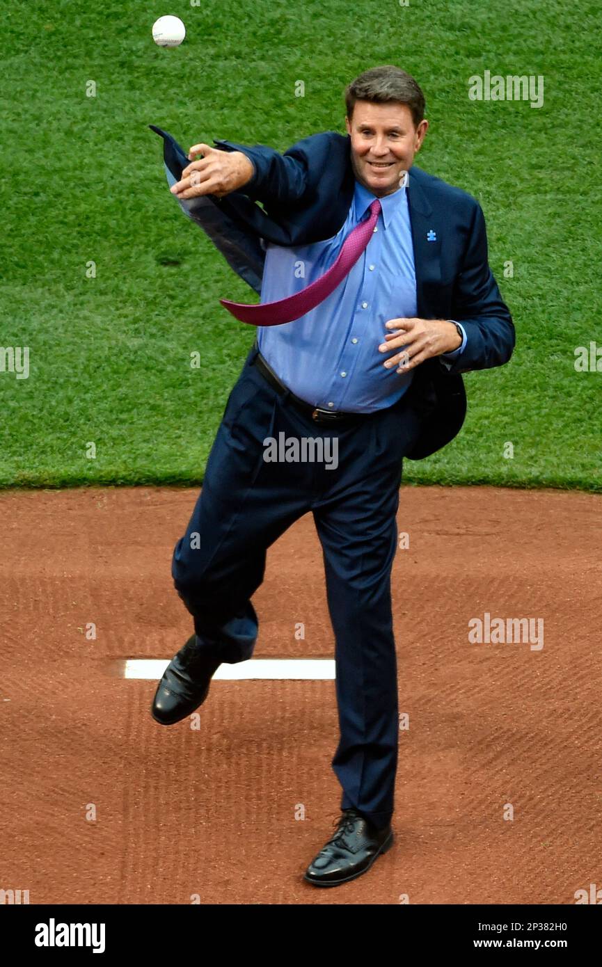 Baltimore Orioles Hall of Fame pitcher Jim Palmer, left, looks on as his  daughter Kelly DeRoche throws a ceremonial pitch prior to a baseball game  between the Baltimore Orioles and the Boston