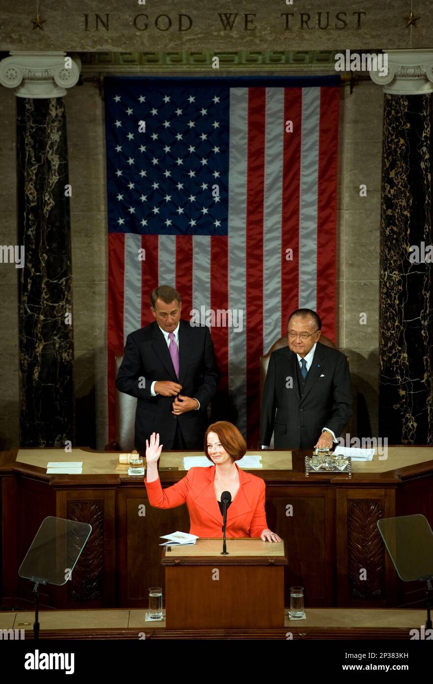 UNITED STATES - MARCH 9: Australian Prime Minister Julia Gillard, waves to the crowd after addressing a joint meeting of Congress on the House floor. Gillard stressed strong historical and current ties between Australia and the Unites States. Speaker John Boehner, R-Ohio, left, and Sen. Daniel Inouye, D-Hawaii, president pro tempore of the Senate, look on. (Photo By Tom Williams/Roll Call) (CQ Roll Call via AP Images) Stock Photo