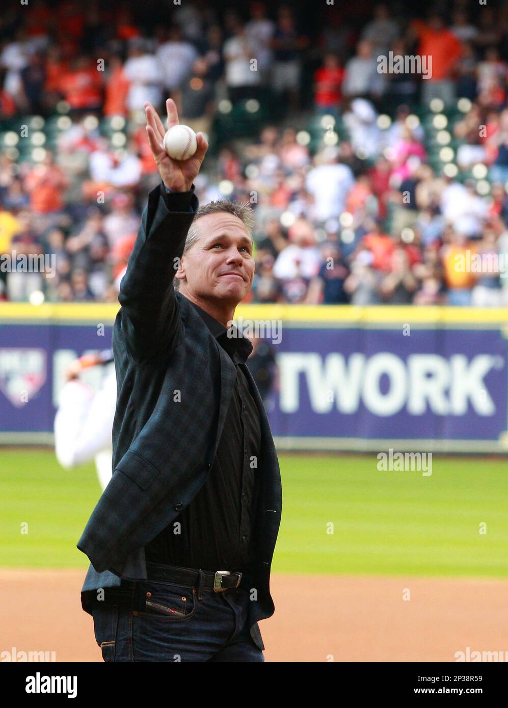 Houston Astros Hall of Famer Craig Biggio waves after throwing out the