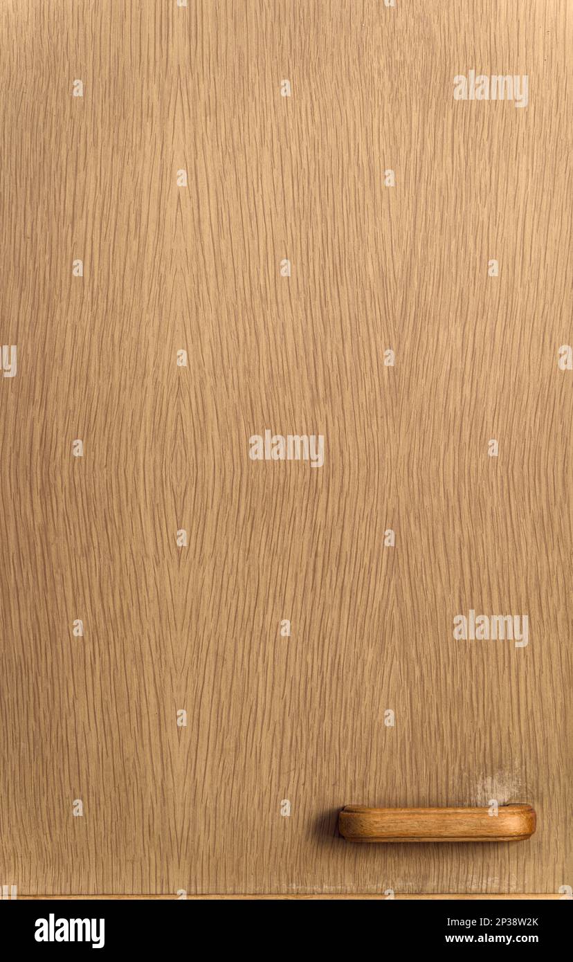 Old worn wooden kitchen door, close up. Background Stock Photo