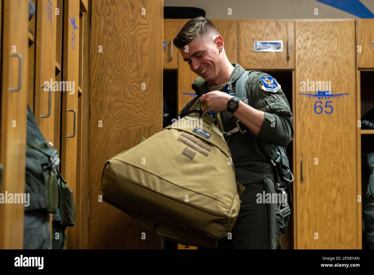 U.S. Air Force 1st Lt. William Laingen, 74th Fighter Squadron A-10C Thunderbolt II pilot, gathers his gear at Moody Air Force Base, Georgia, Jan. 4, 2023. Before flying, pilots put on their G-suit and harness, then place their helmet in a bag to carry to the aircraft. The harness connects the pilot to their seat to ensure proper ejection in case of an emergency. Stock Photo