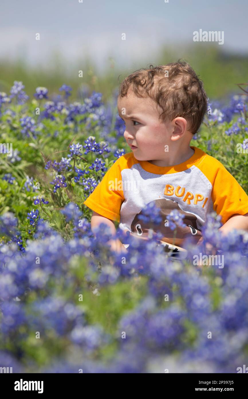 In this photo taken Tuesday, March 24, 2015, Chevy Lemos, 2, sits among