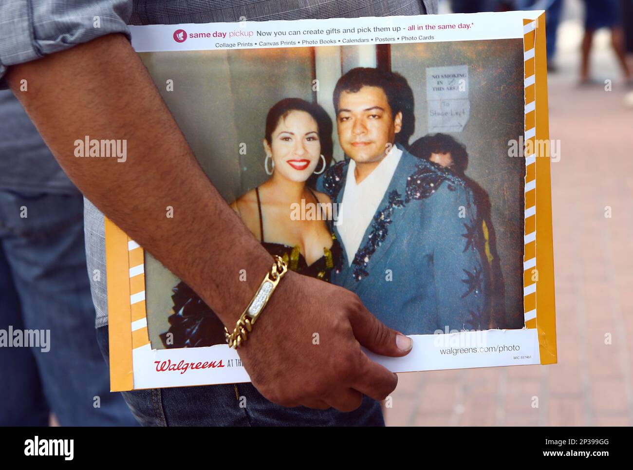 Polo Garza from Mexico holds a photo he took with Selena Quintanilla