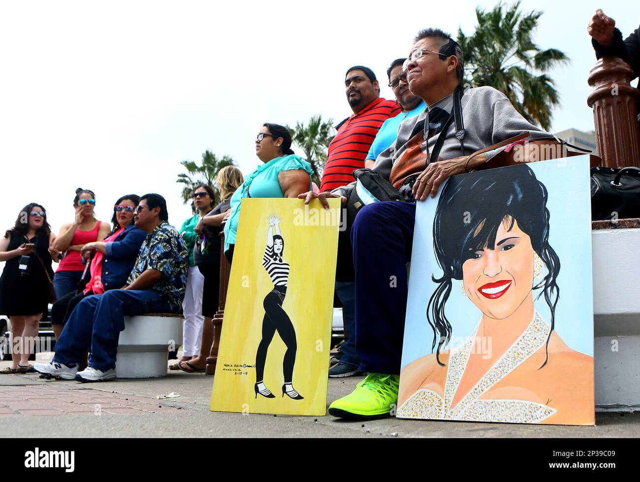 A fan gathers with art depicting Selena QuintanillaPérez on Tuesday