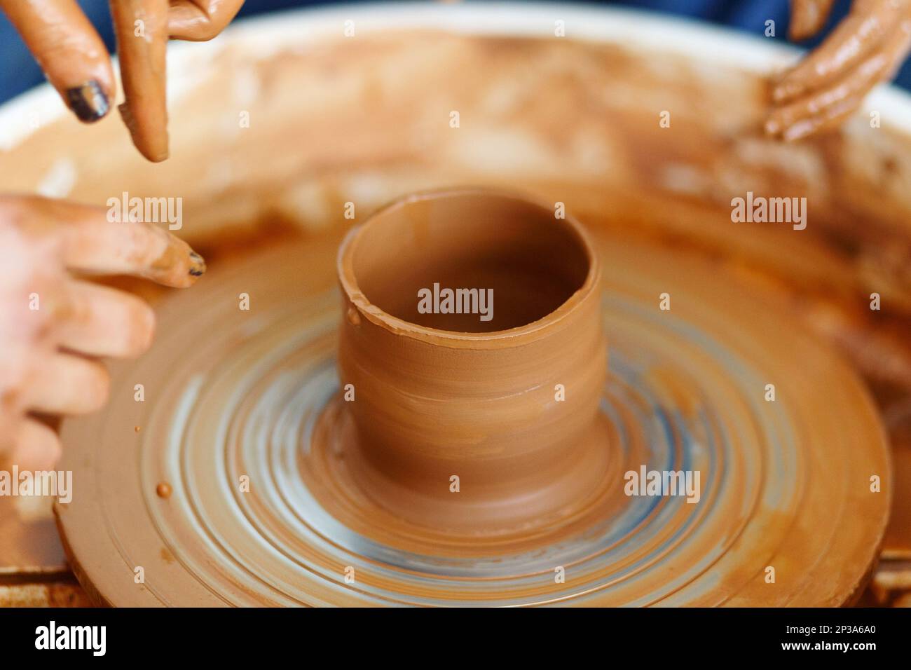 Cropped Image of hands working with Pottery Wheel, education classes Stock Photo