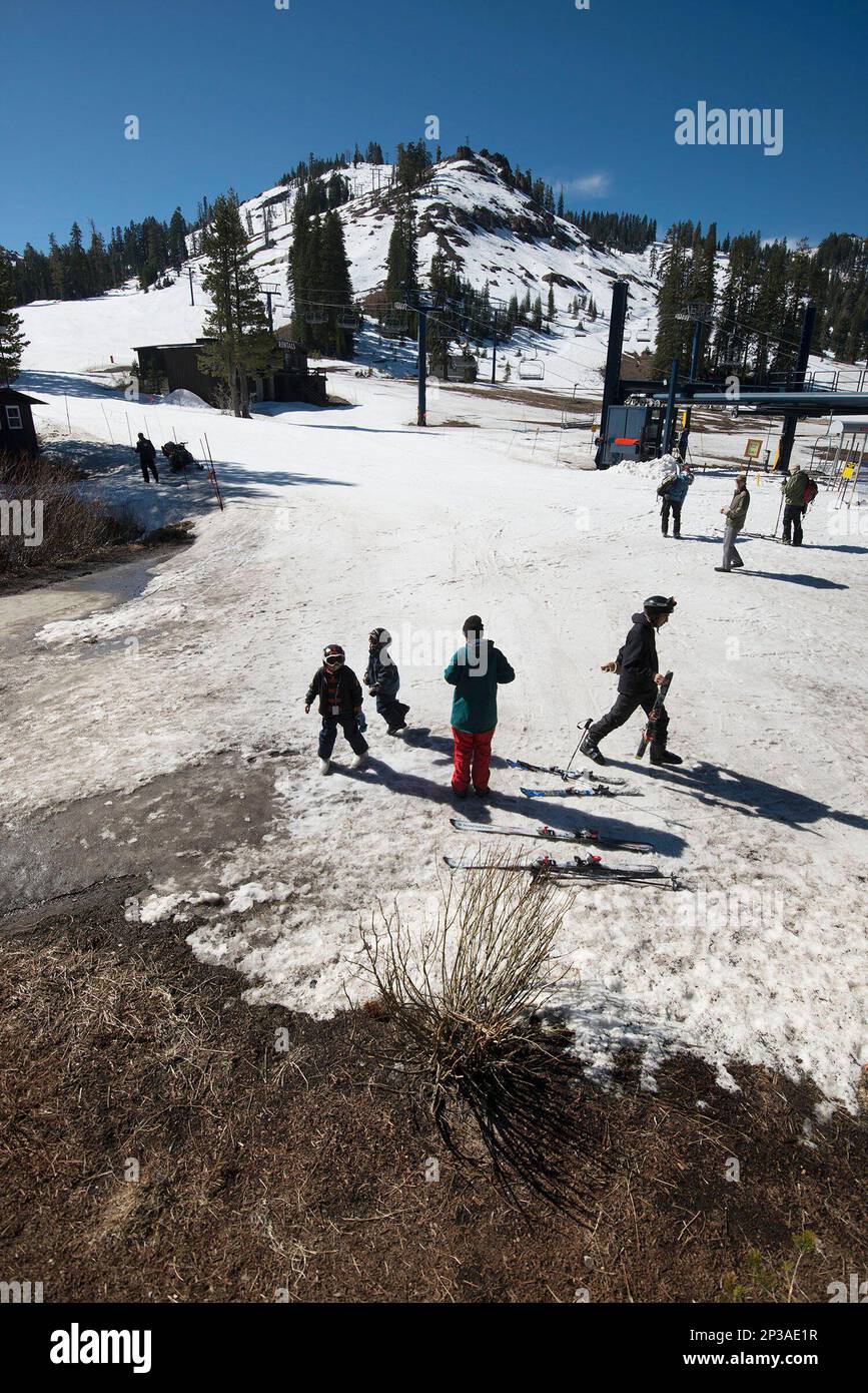 Warm Winter weather has melted snow where skiers congregate near a lodge  below Mt. Disney, background, at Sugar Bowl Ski Resort on Wednesday, March  18, 2015, in Norden, Calif. Sugar Bowl will