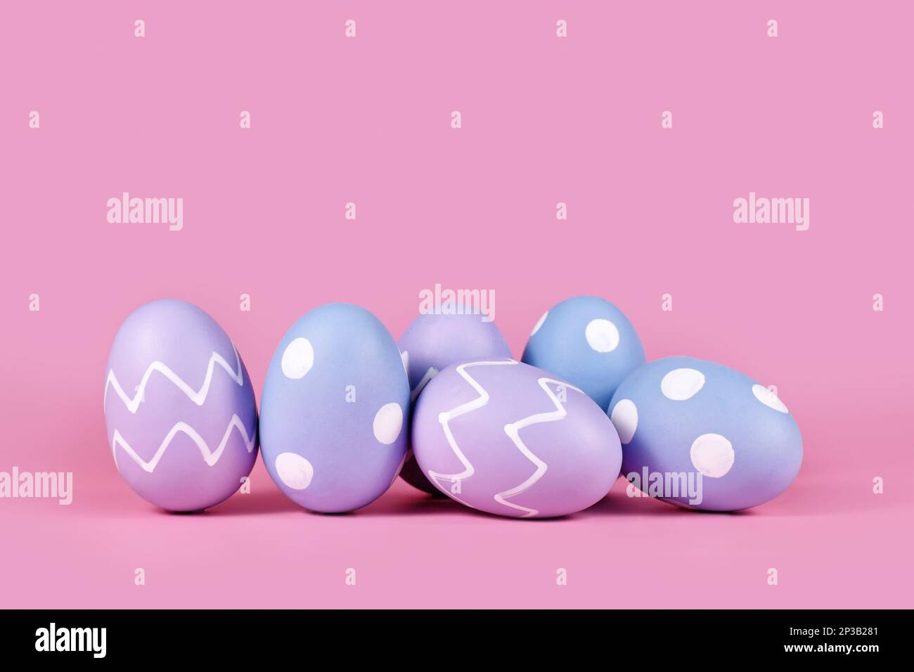 Pastel colored Easter eggs on pink background with copy space Stock Photo Alamy
