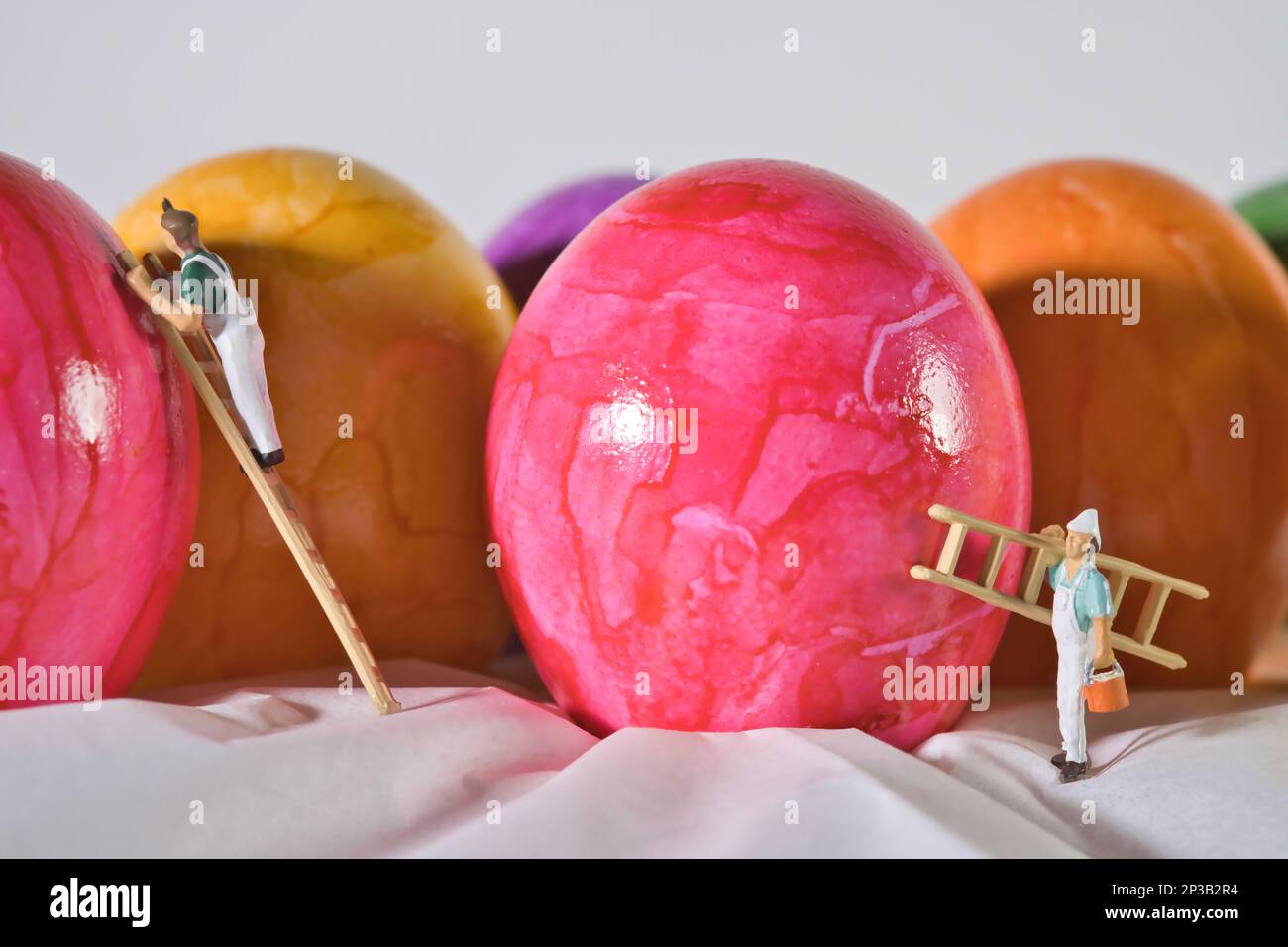 Painters paint eggs for Easter, colorful Easter eggs Stock Photo Alamy
