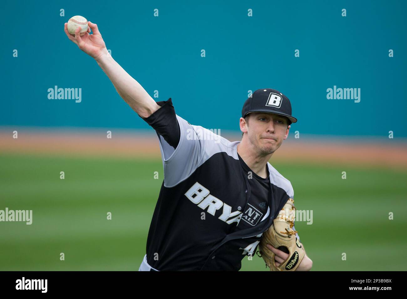 Bryant Bulldogs pitcher James Davitt 4 warms up in the outfield