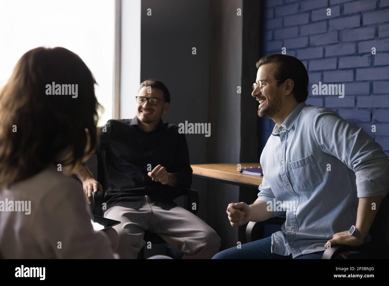 Business team of cheerful employees brainstorming on meeting Stock ...