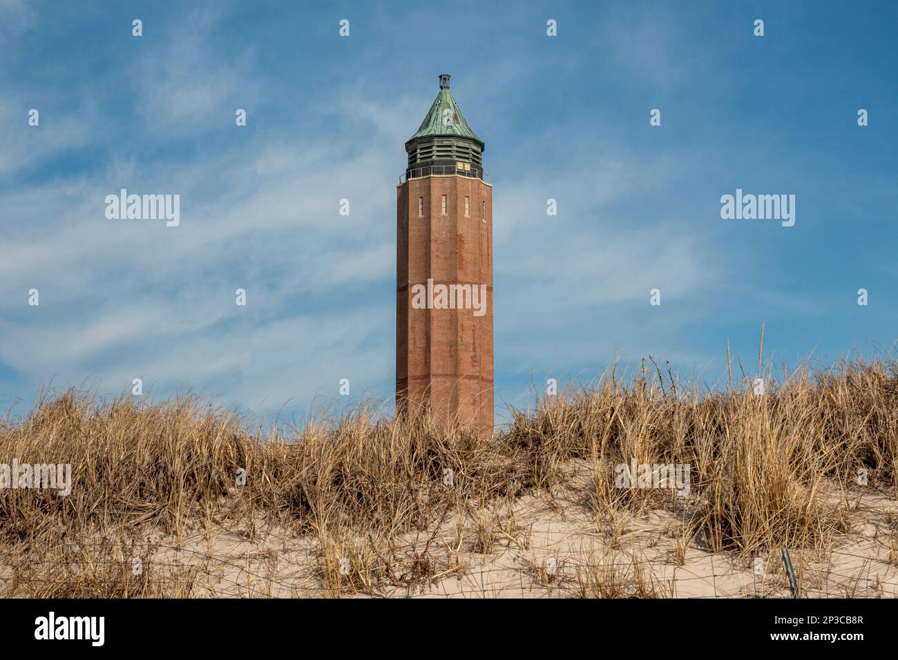 The Robert Moses Water Tower sticking up over the sand dunes with beach grass on Fire Island State Beaches. Stock Photo