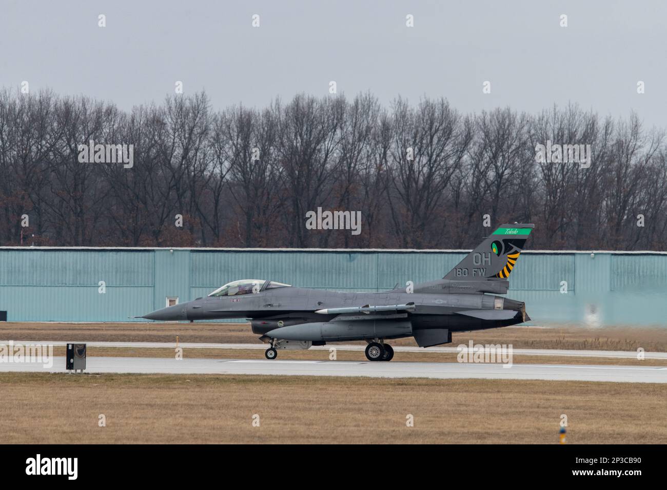 A U.S. Air Force F-16 Fighting Falcon, assigned to the Ohio National Guard’s 180th Fighter Wing, takes off for a training flight at the 180FW in Swanton, Ohio, Jan. 8, 2023. The 180FW is the only F-16 fighter wing in the state of Ohio, whose mission is to provide for America; protection of the homeland, effective combat power and defense support to civil authorities, while developing Airmen, supporting their families and serving in our community. Stock Photo