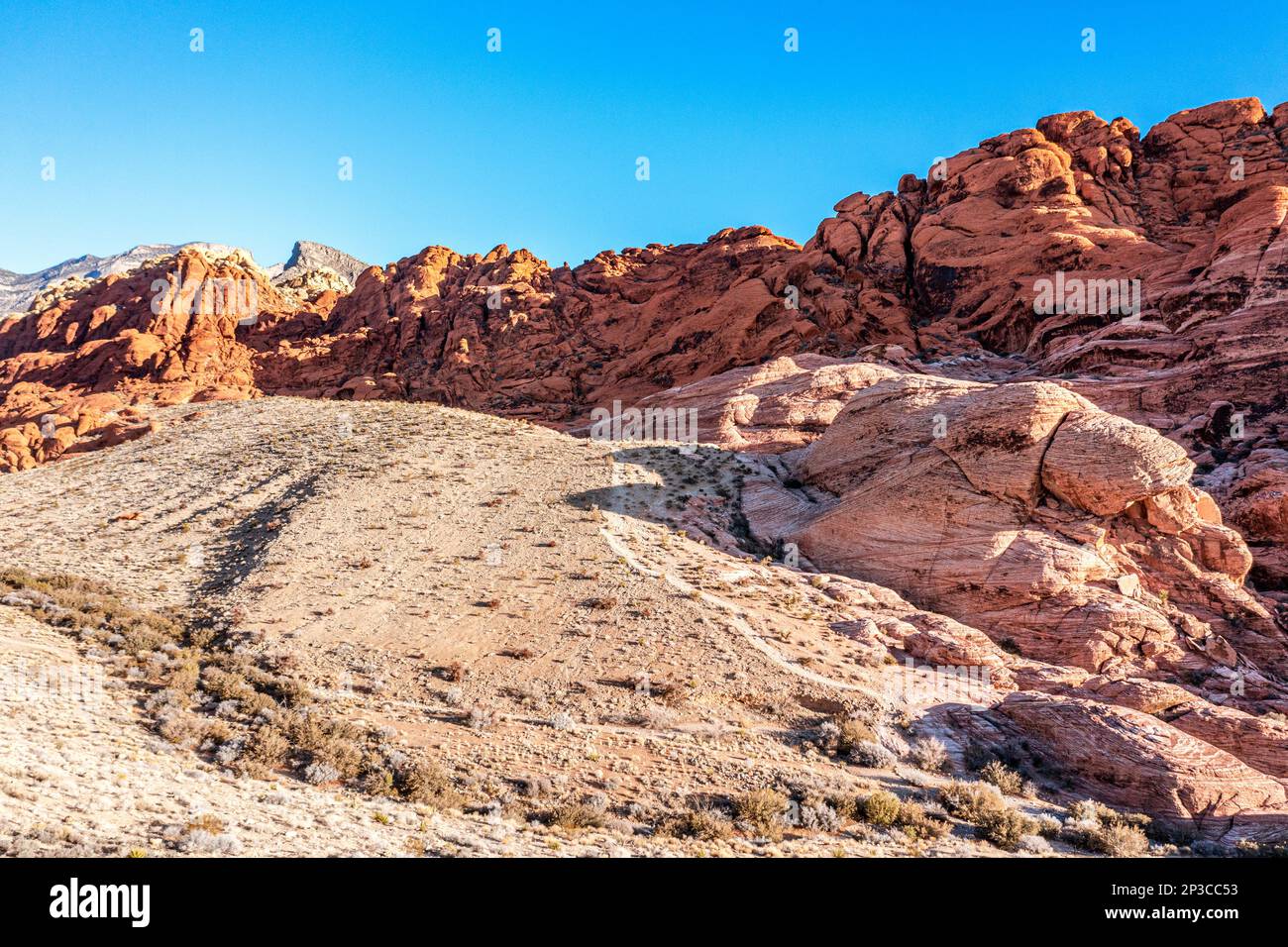 A beautiful, arid, rugged and mountainous scene in the wilderness of Red Rock Canyon in Las Vegas, Nevada, where families travel for adventure. Stock Photo
