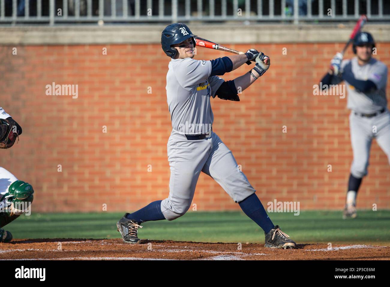 John Clay Reeves (7) of the Rice Owls follows through on his swing ...