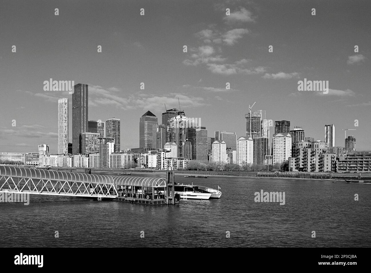 Greenland Surrey Quays Pier and Canary Wharf on the River Thames, South East London, UK Stock Photo