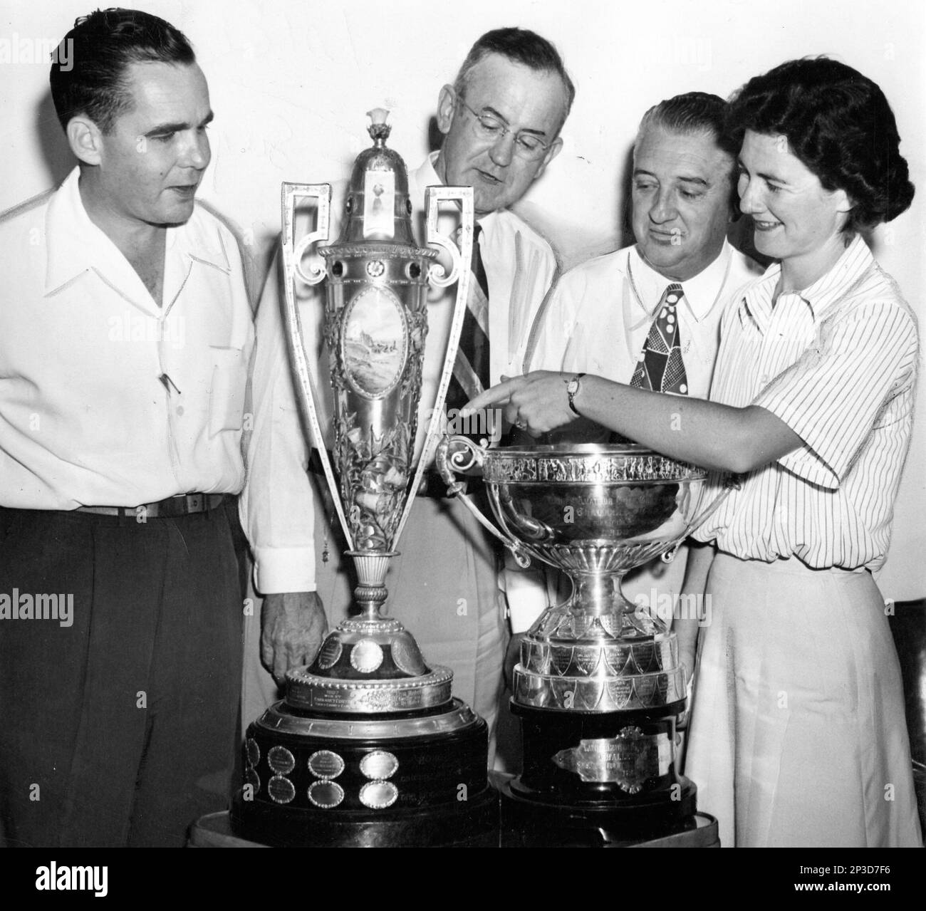 Officials of the Sunset Hill Country Club gaze on the two top women's