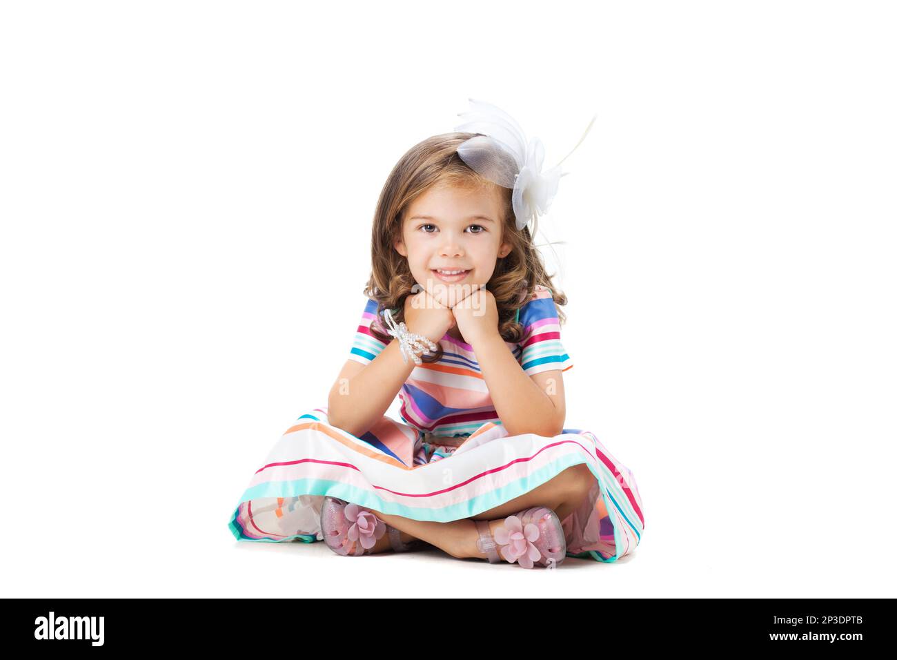 happy little girl sitting on the floor, isolated on white Stock Photo ...