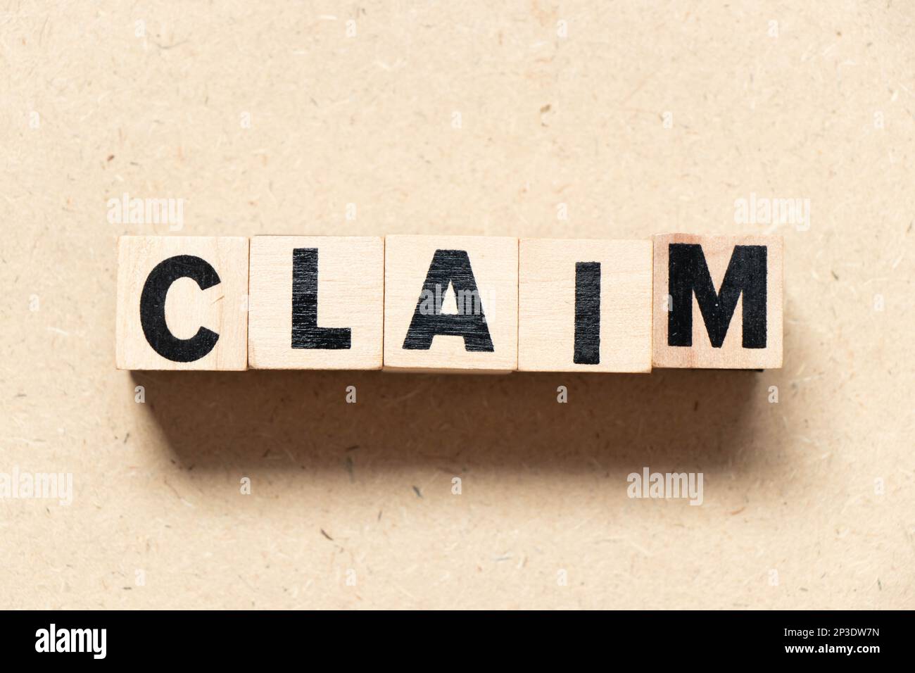 Alphabet letter block in word claim on wood background Stock Photo - Alamy