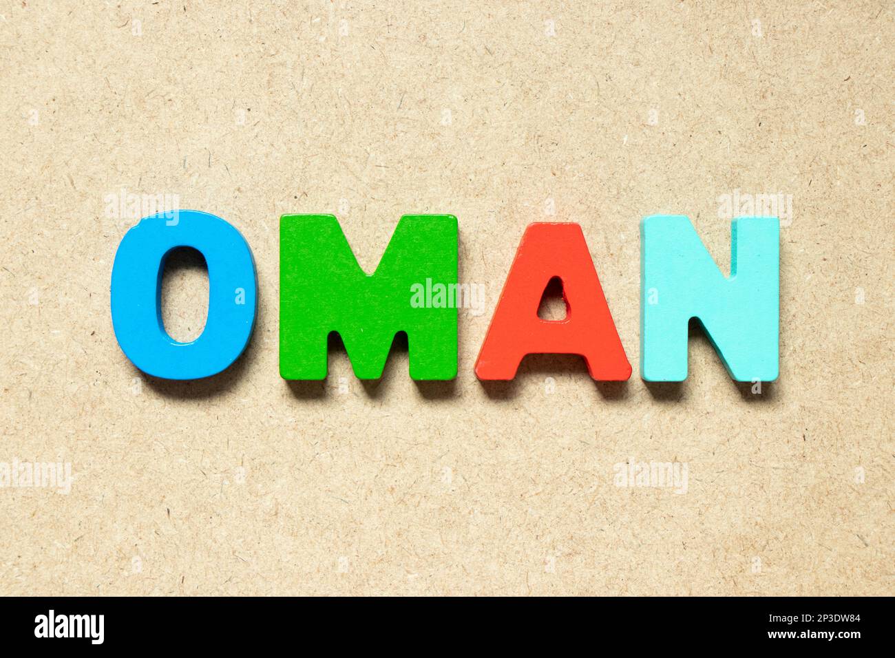 Color alphabet letter in word oman on wood background Stock Photo Alamy