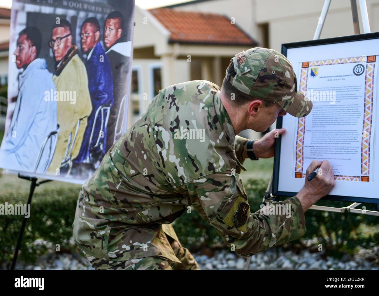 U.S. Air Force Brig. Gen. Tad Clark, 31st Fighter Wing commander, signs the Black History Month proclamation during the signing ceremony at Aviano Air Base, Italy, Feb. 1, 2023. BHM recognition was extended from a week to a month by U.S. president Gerald Ford in 1976 to honor the accomplishments of Black Americans throughout history. Stock Photo