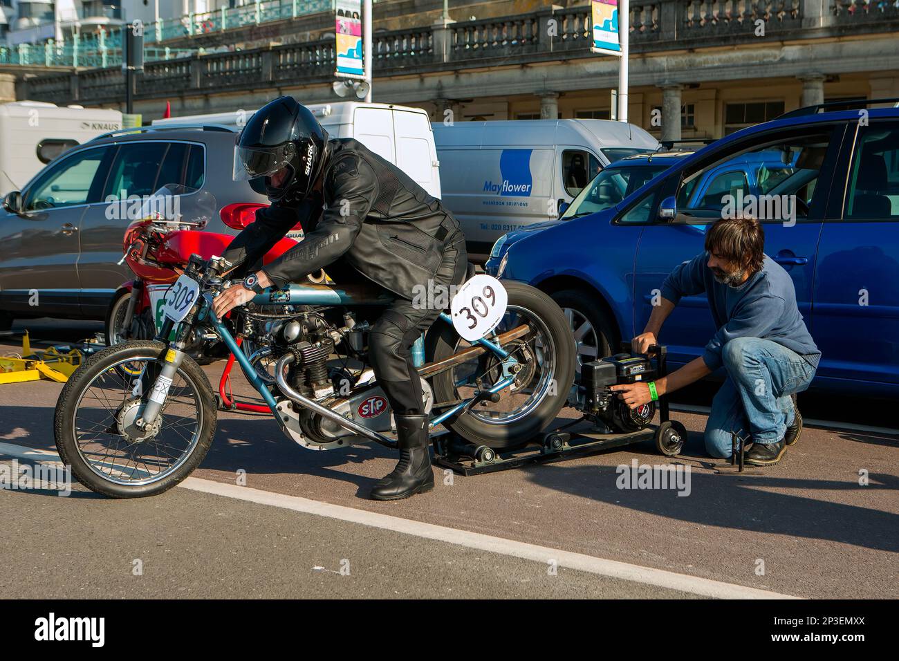 The event is currently run as a quarter mile sprint for both cars and motorcycles, held under the auspices of the Motor Sports Association. This image features Alan Kiltie having work done on his Norton Dominator Special. The event is organised by the Brighton and Hove Motor Club run along Madeira Drive, Brighton Sea Front, City of Brighton & Hove, UK. 1st September 2018 Stock Photo