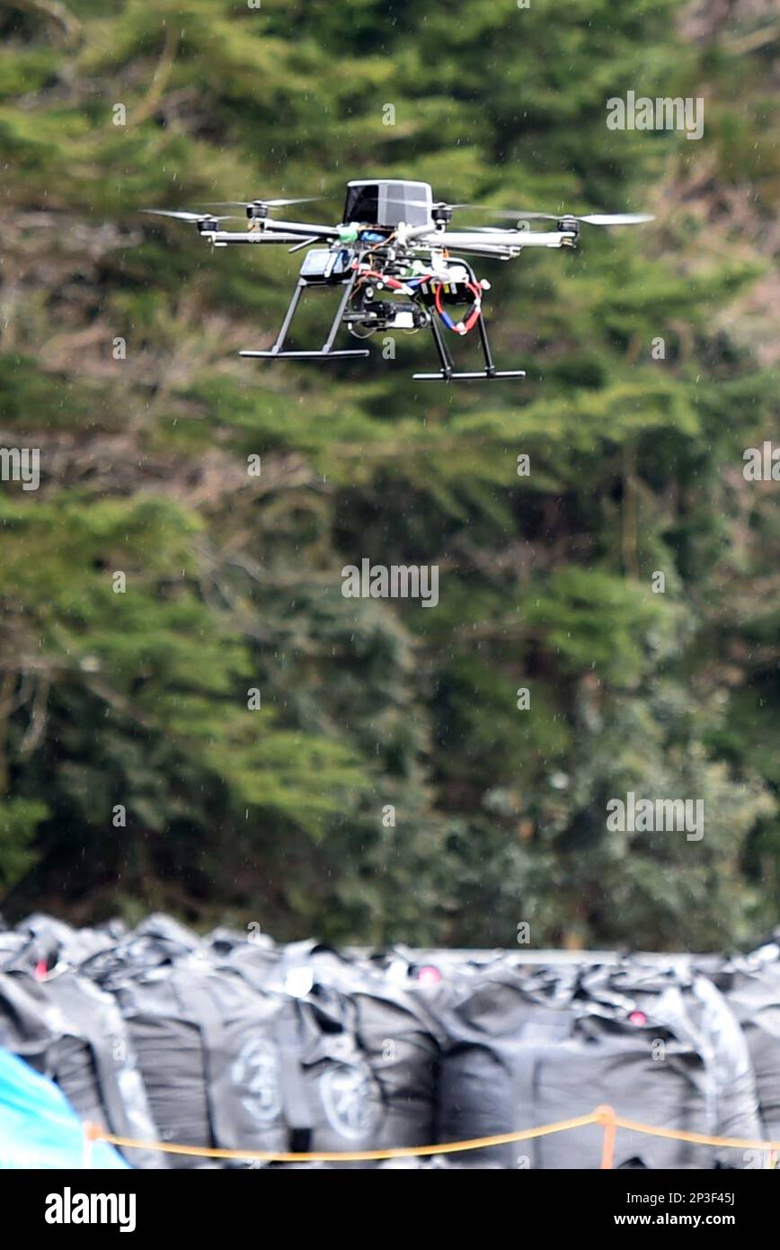 A a tiny unmanned aircraft, to be mass-produced type takes a maiden for about 30 minutes over an evacuation zone caused by the crippled Fukushima No. 1 nuclear power plant