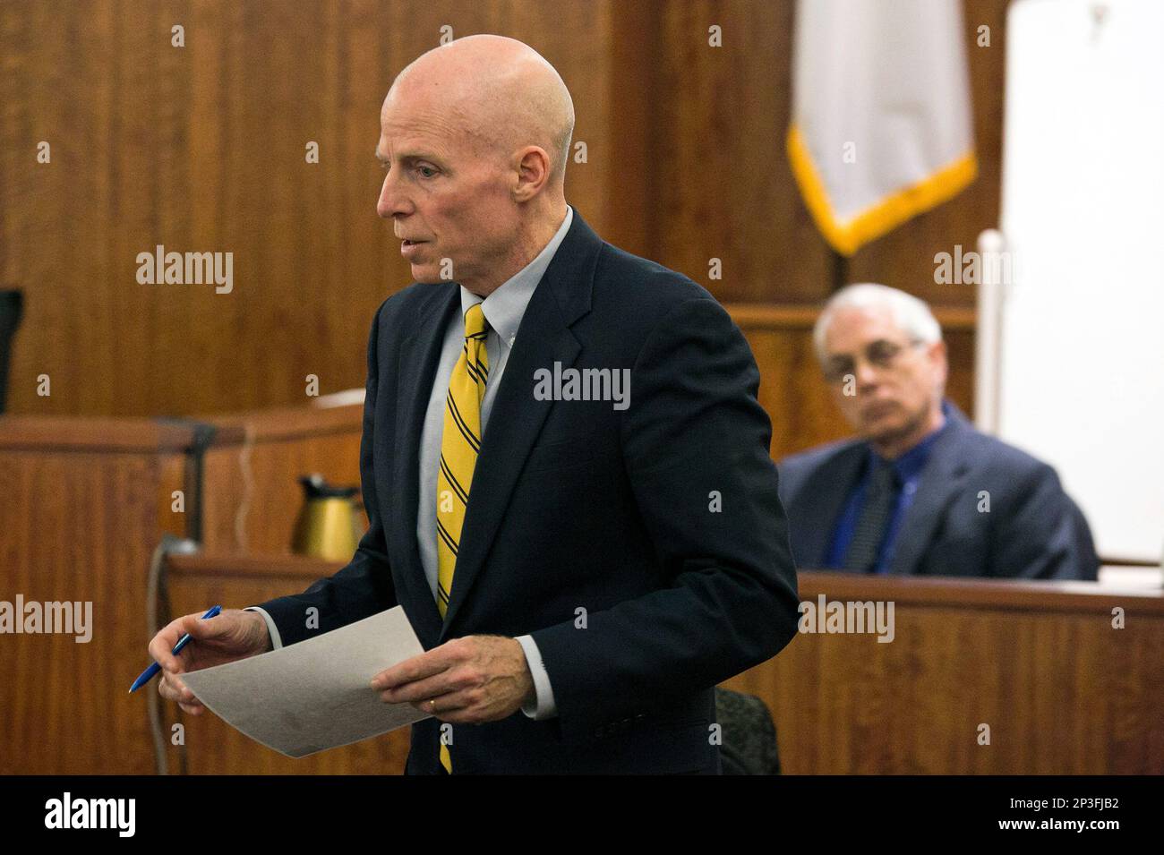 District Attorney William McCauley examines a witness during the murder trial for former NFL